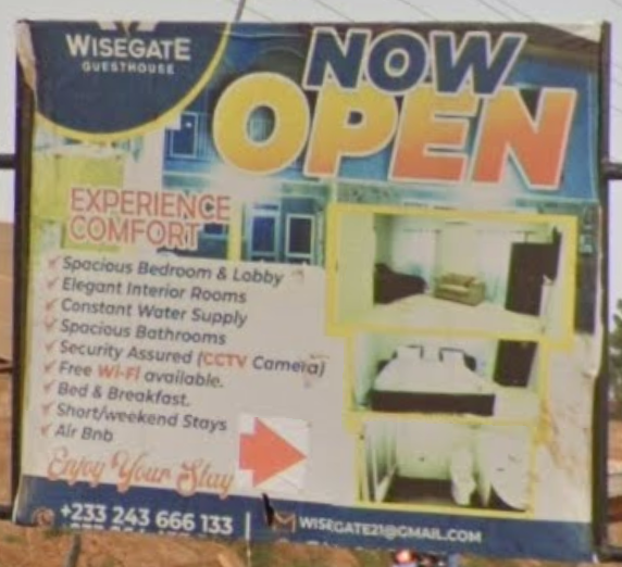 Wisegate Guesthouse promotional sign